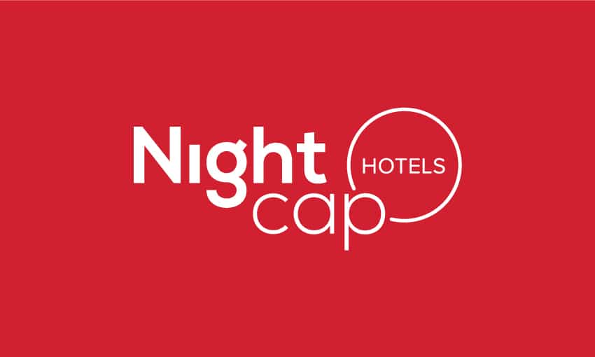 Nightcap Hotels logo on a vibrant red background. The logo includes the word "Night" in bold, capitalized letters, "HOTELS" below it in a slightly smaller font, and "cap-" with a hyphen. The logo represents quality, affordability, and comfort at over 75 locations across Australia.