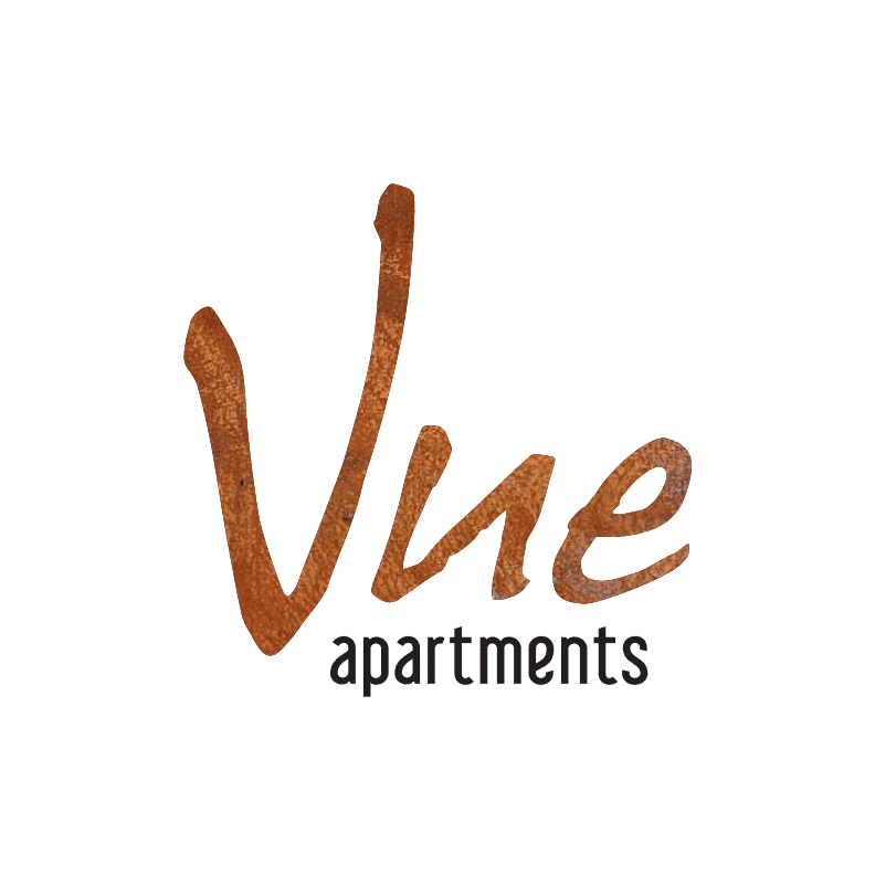 Vue Apartments logo with the word "apartments" in black letters on a white background. The logo represents a stylish and convenient living experience near Shopping Centres, Royal Geelong Yacht Club, waterfront restaurants, and cultural attractions. Additional elements like the rusty letter "e" and the letters "na" and "wine" add visual interest to the composition.